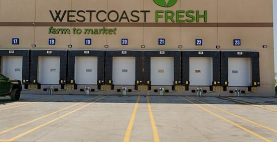 Loading dock doors on the exterior of a cold storage facility built by Guzman Construction