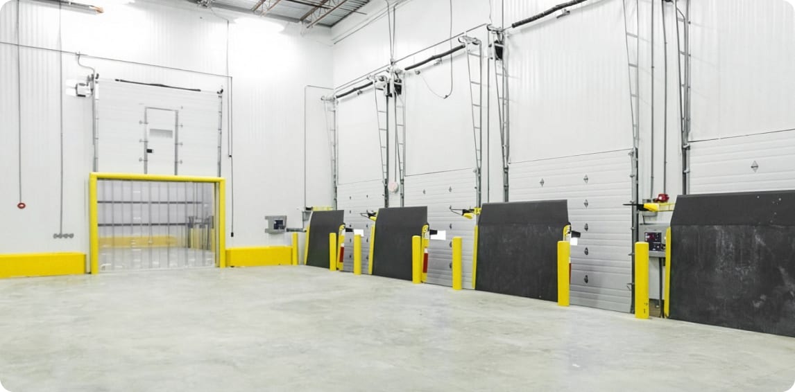 Loading dock bays inside a commercial warehouse built by Guzman Construction