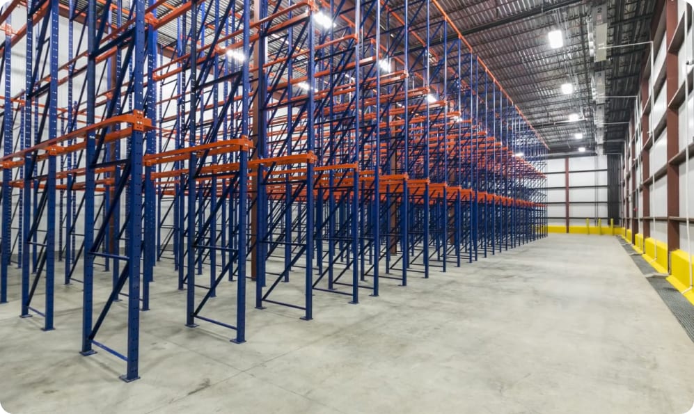 Steel storage racking inside a commercial warehouse built by Guzman Construction